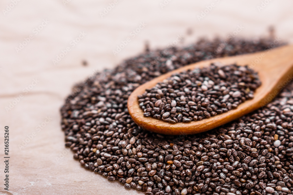 chia seeds on a light rustic background chia seeds on a light rustic background