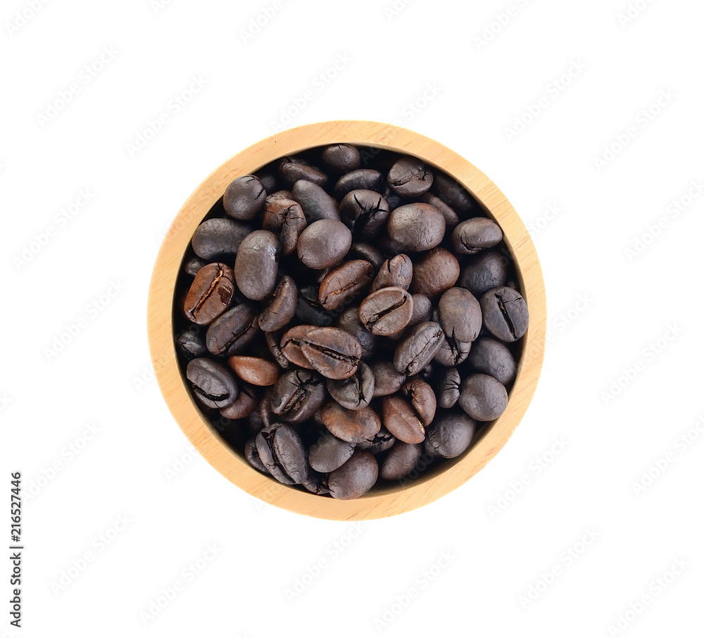 Fototapeta premium Wooden Bowl with coffee beans and coffee leaf on white background.