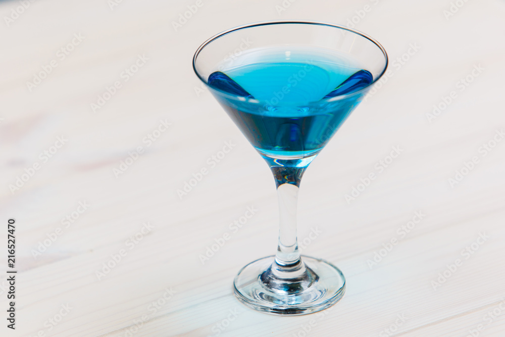Blue lagoon coctail on white board macro Blue lagoon coctail on white board macro