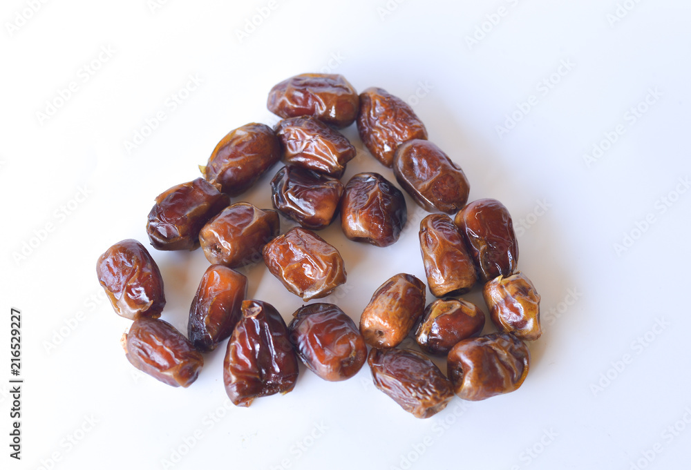 dried dates isolated on white background. selective focus. dried dates isolated on white background. selective focus.