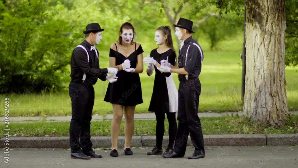 Mimes play Rock Paper Scissors in the park Mimes play Rock Paper Scissors in the park