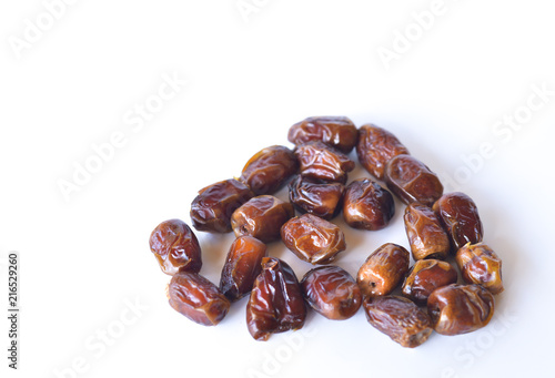 dried dates isolated on white background. selective focus.