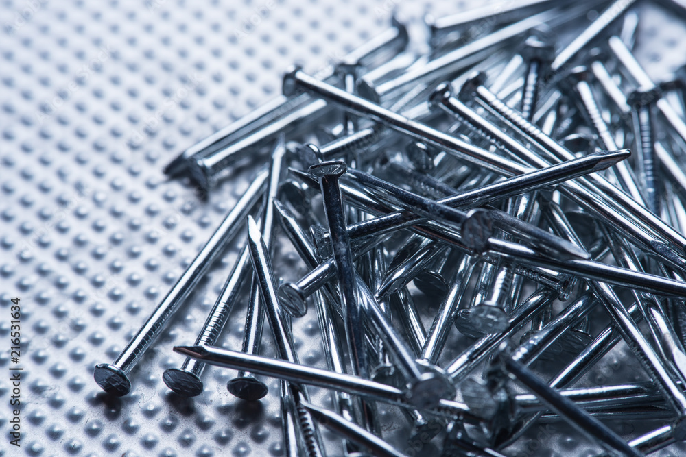 Nail pile, masonry nail, concrete nail background Nail pile, masonry nail, concrete nail background