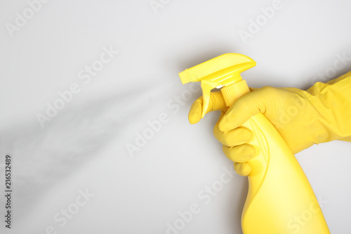 Wallpaper Mural hand yellow glove and yellow bottle sprayer Torontodigital.ca