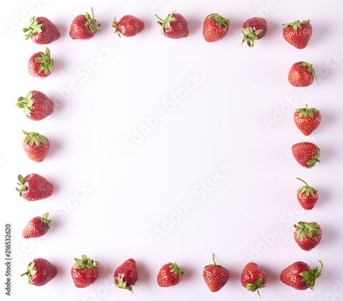 square made with freshly harvested strawberries isolated on white