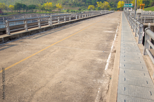 Fototapeta Naklejka Na Ścianę i Meble -  Concrete road over the dam in Thailand.