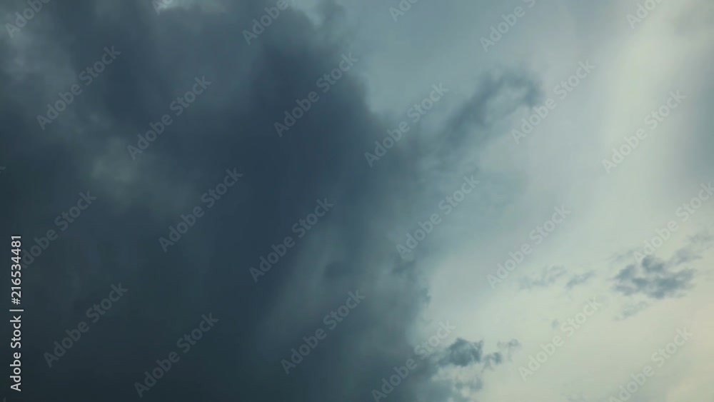 Fast moving clouds, White clouds running over blue sky. Time Lapse, Storm clouds lift, reveal bright white fluffy mass forming in blue sky. Fast moving clouds, White clouds running over blue sky. Time Lapse, Storm clouds lift, reveal bright white fluffy mass forming in blue sky.
