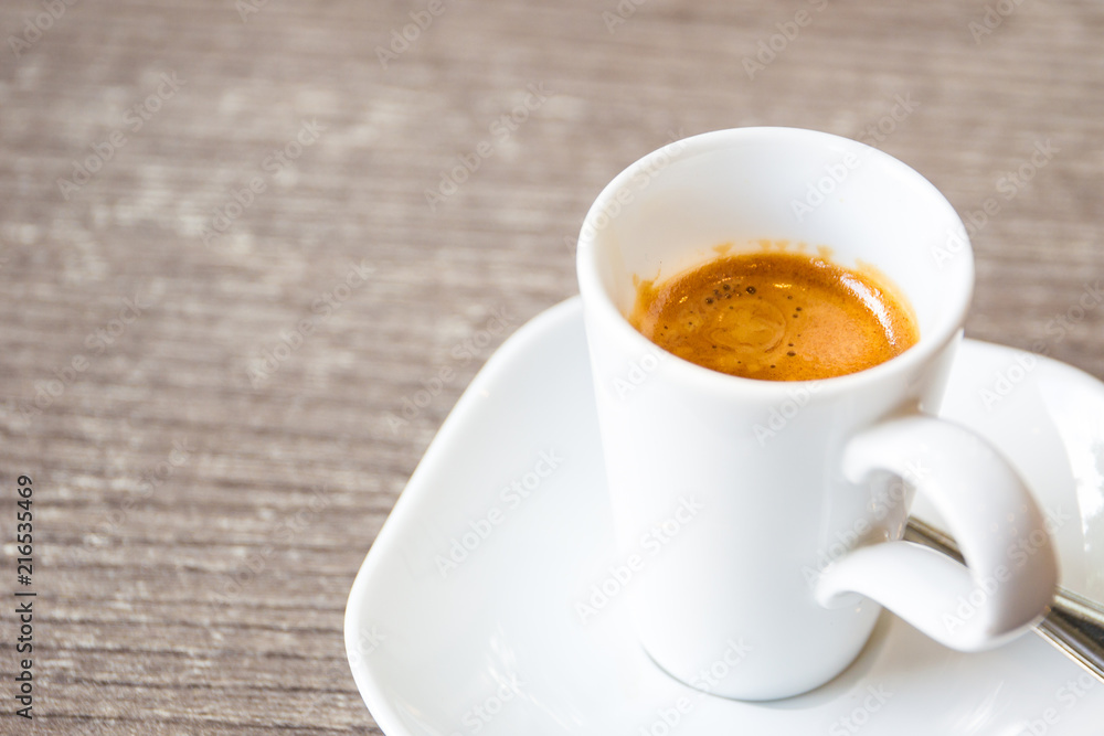 Shot of espresso in the white cup close up. Shot of espresso in the white cup close up.