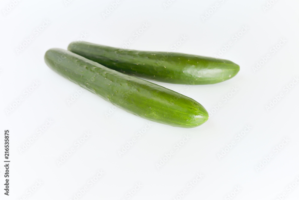 fresh green cucumbers isolated on white background. fresh green cucumbers isolated on white background.