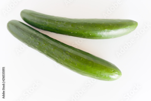 fresh green cucumbers isolated on white background.