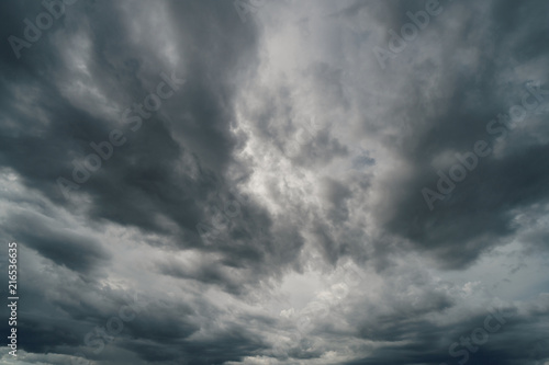 Dramatic thunder storm clouds at dark sky