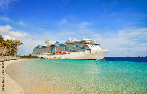 View from beach at tropical resort on cruise ship docked at port  © NAN