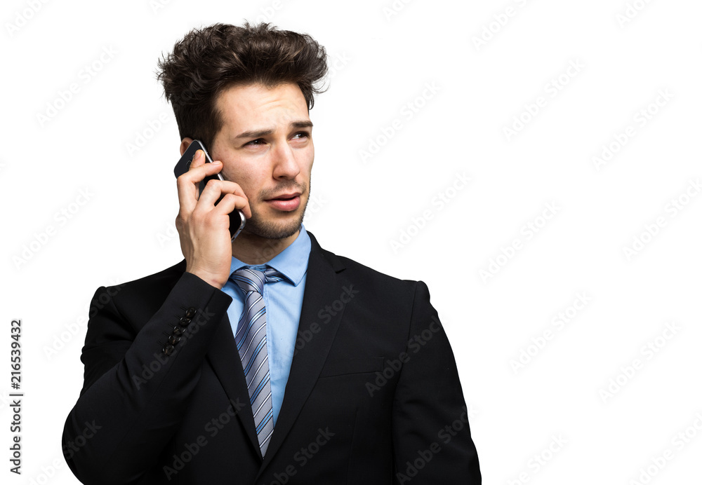 Smiling businessman talking at the phone Smiling businessman talking at the phone