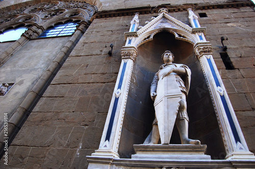 Florence, Italy / July - 7 2016: a view of Saint George sculpture by Donatello, located in the facade of Orsanmichele church photo