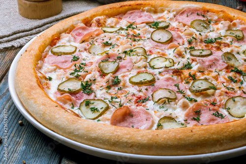 pizza with ham and cucumbers