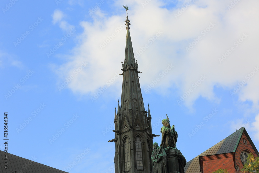 Beautiful view on top of famous historical Cathedral, Uppsala, Sweden, Europe. Blue sky with white clouds background. 