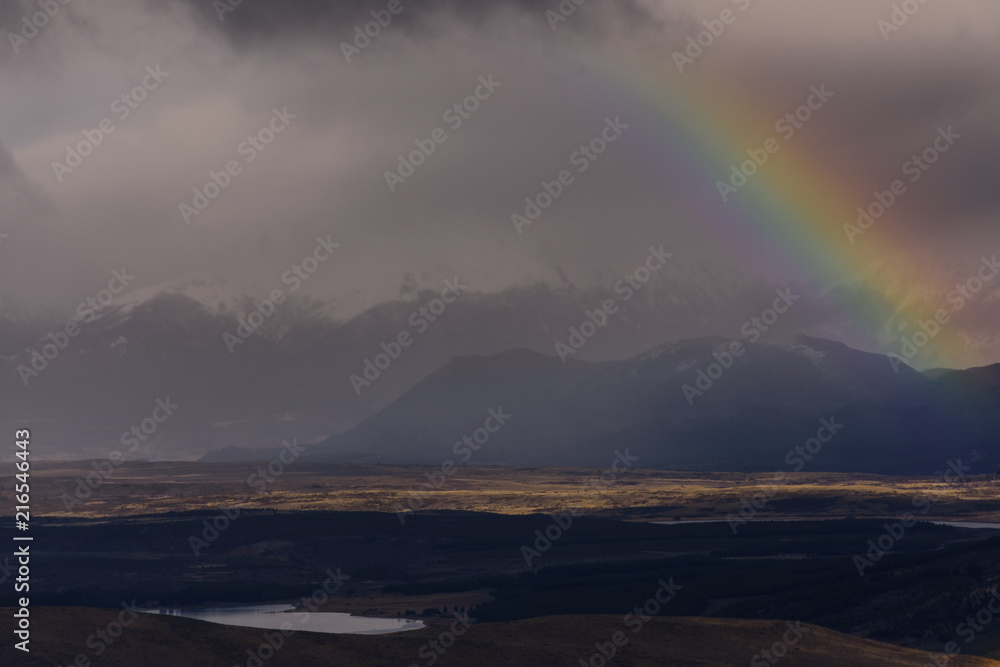 Scenic View Of Rainbow In A Wide Landscape