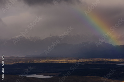 Scenic View Of Rainbow In A Wide Landscape