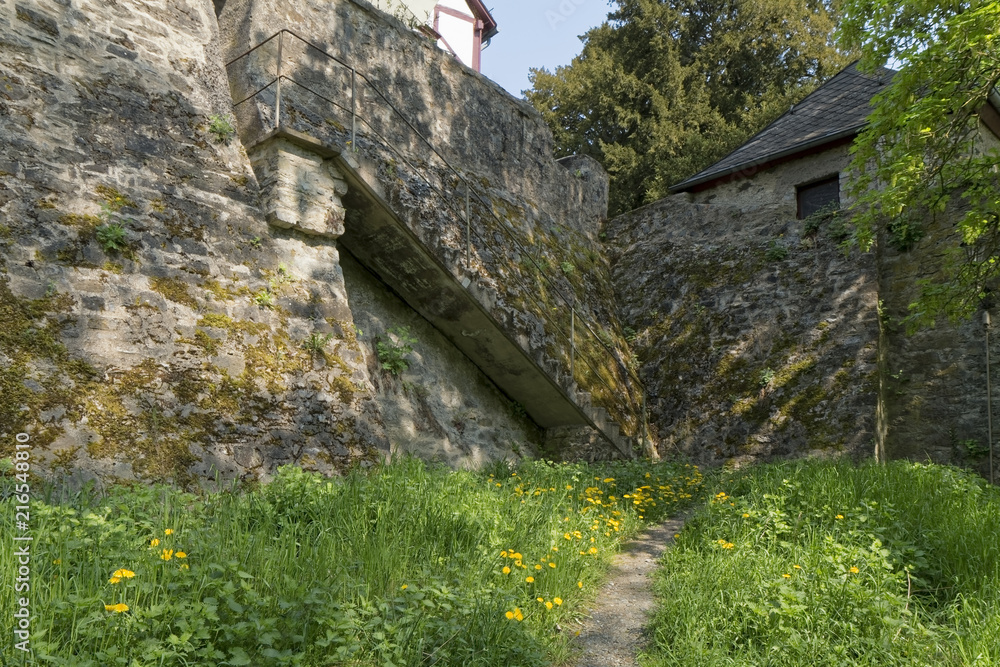 Braunfels, Germany - Old, damaged, stone stairs by the castle. Braunfels, Germany - Old, damaged, stone stairs by the castle.