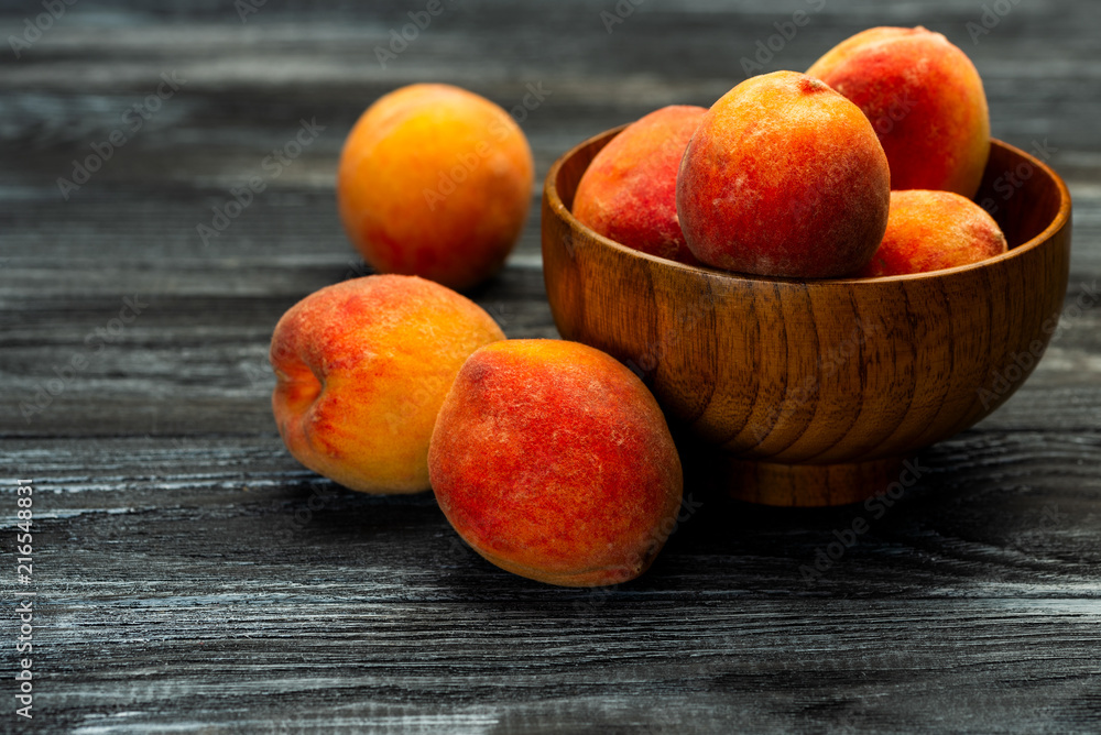 plate with fresh and ripe peaches on a table plate with fresh and ripe peaches on a table