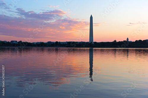 Washington DC cityscape at sunrise on a hot summer day. Panoramic view of Tidal Basin with Washington Monument in a cityscape landscape.