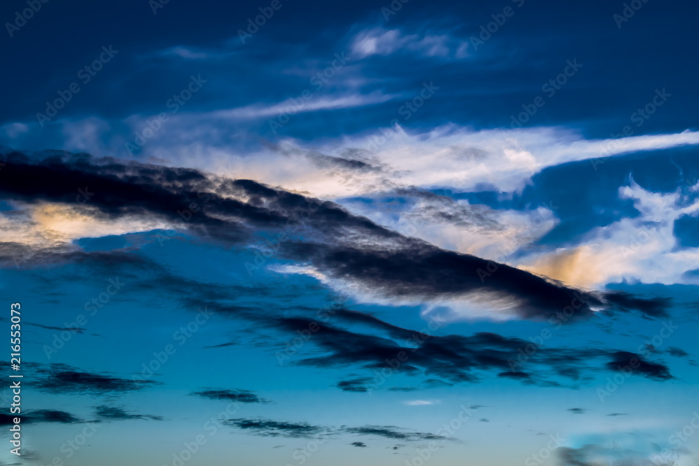 Fototapeta premium Natural background, natural, bright and rich texture. Sky with clouds. Warm weather. Spectacular colors.