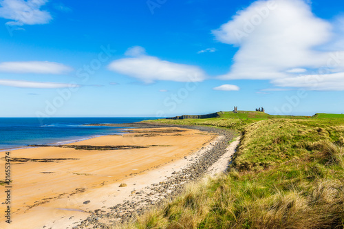 Beach at Dunstanburgh Castle in Northumberland photo