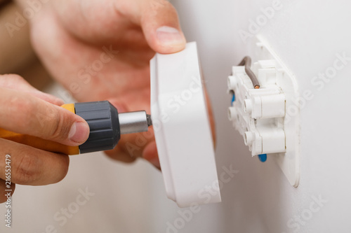 electrician installing electrical socket