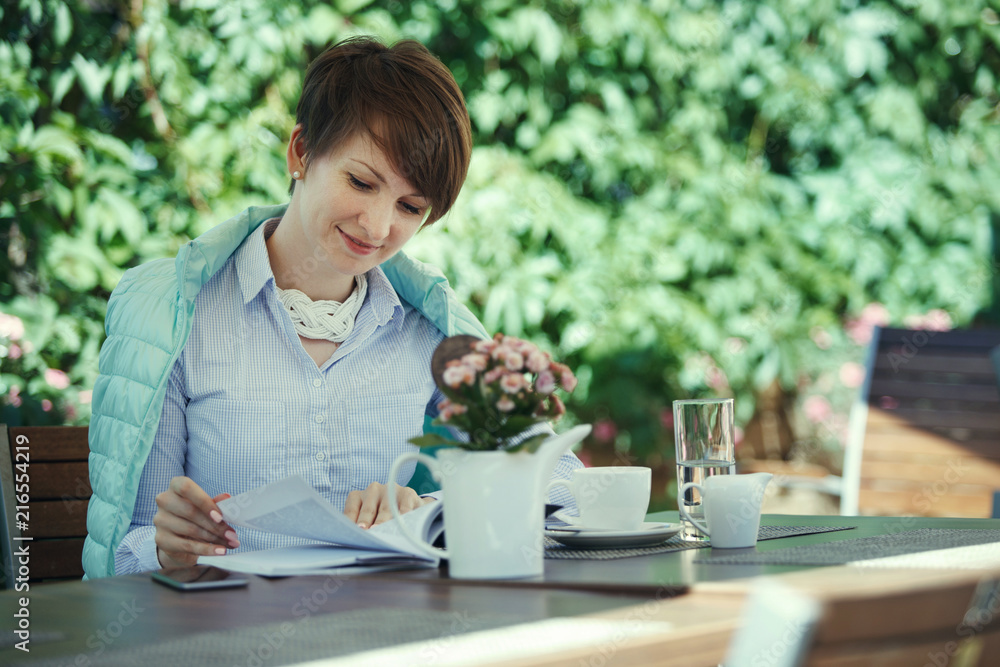 Young cute woman drinks coffee. Young cute woman drinks coffee.