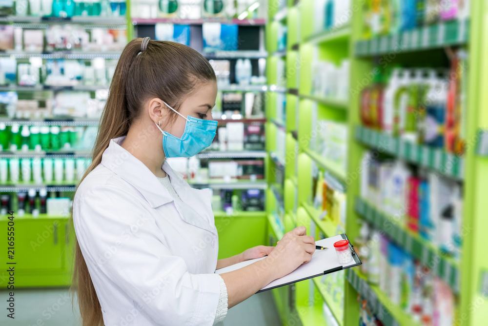 Woman chemist checking medication list in drugstore