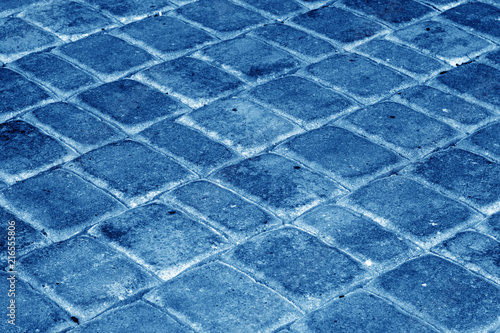 Cobble stone pavement in navy blue tone.