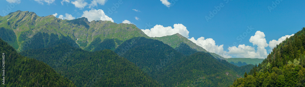 Panorama of mountains and sky with clouds. Wallpaper