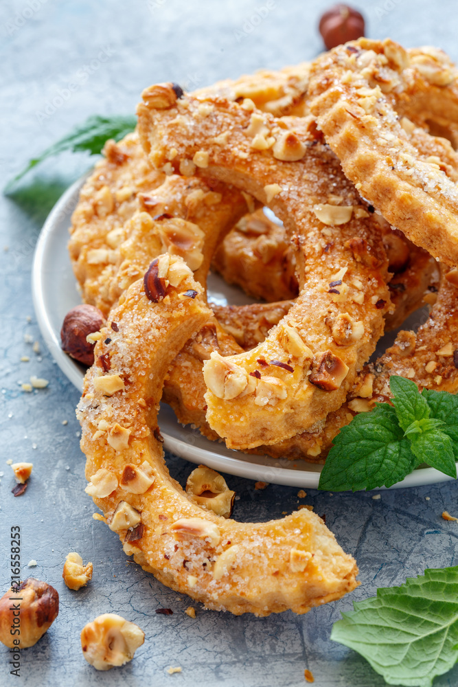 Shortbread rings sprinkled with nuts and sugar. Shortbread rings sprinkled with nuts and sugar.