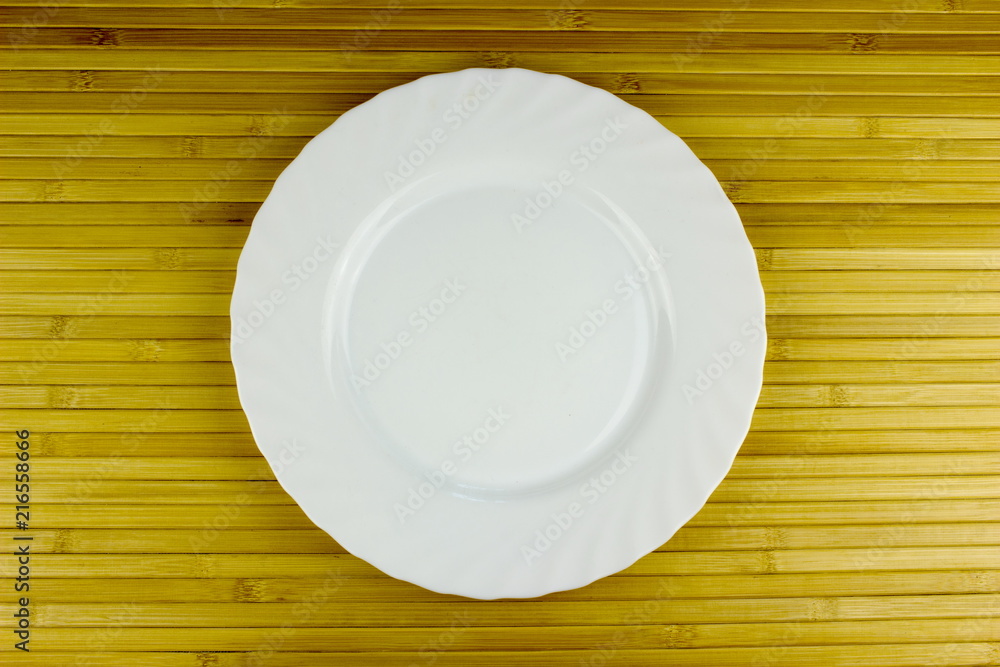 Color empty plate on a table. Food and restaurant concept Color empty plate on a table. Food and restaurant concept
