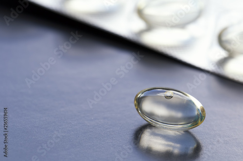 Gelatin capsules on black background. Pills