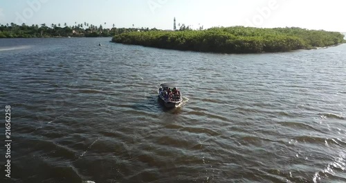 Follow a boat on the river by drone