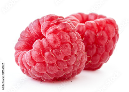 ripe red raspberry fruits isolated on white background