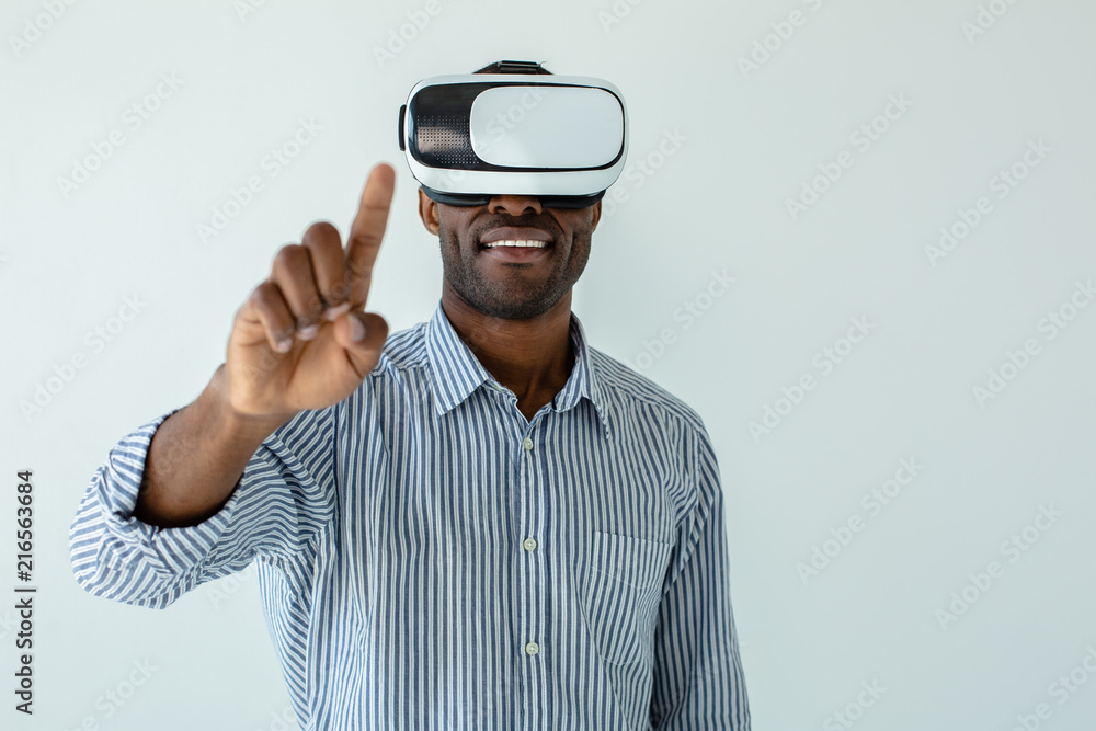 Close up of cheerful afro american man touching ahead Close up of cheerful afro american man touching ahead