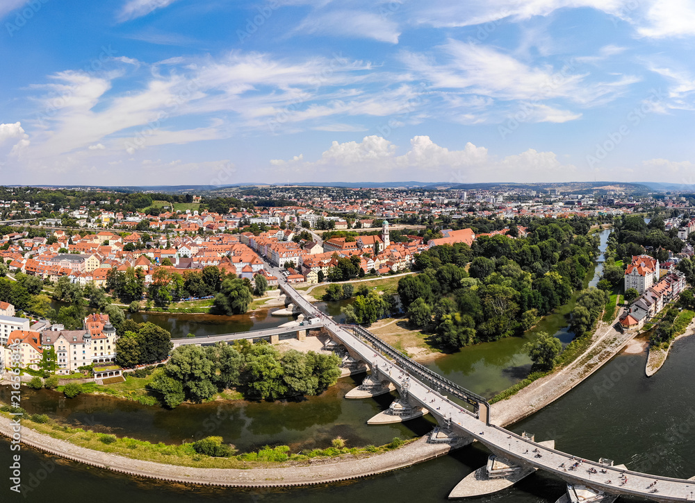 Danube river, Stone Bridge and architecture of Regensburg city, Germany. Aerial photography