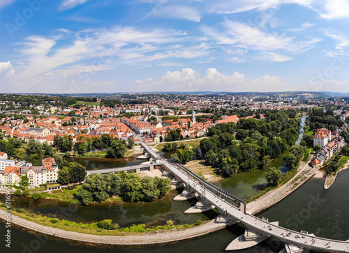 Danube river, Stone Bridge and architecture of Regensburg city, Germany. Aerial photography