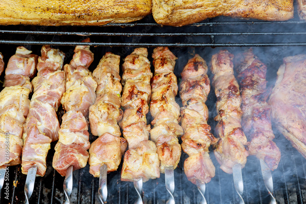 Fresh meat shish kebab prepared on a grill.