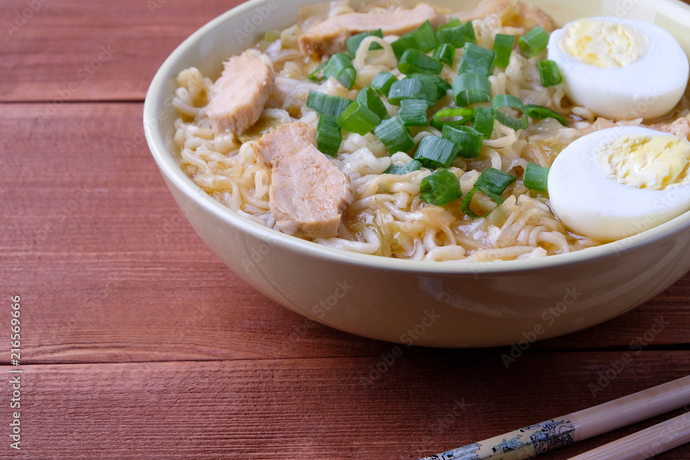 Chinese chicken soup. Cooked in a wok.Wooden background. Chinese chicken soup. Cooked in a wok.Wooden background.