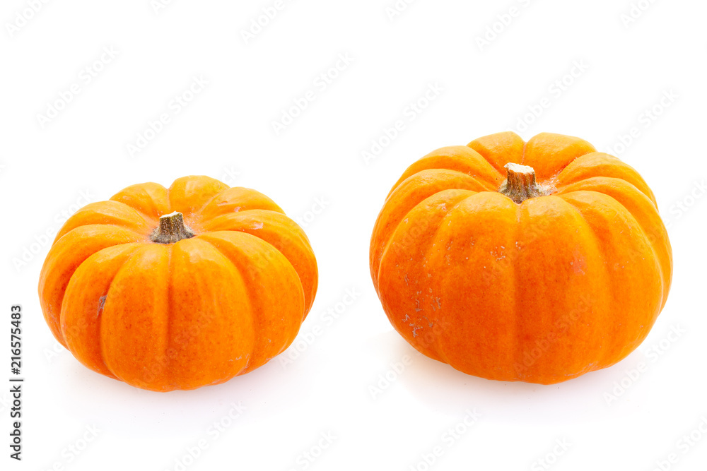 Obraz premium Two fall harvest of pumpkins isolated on white background