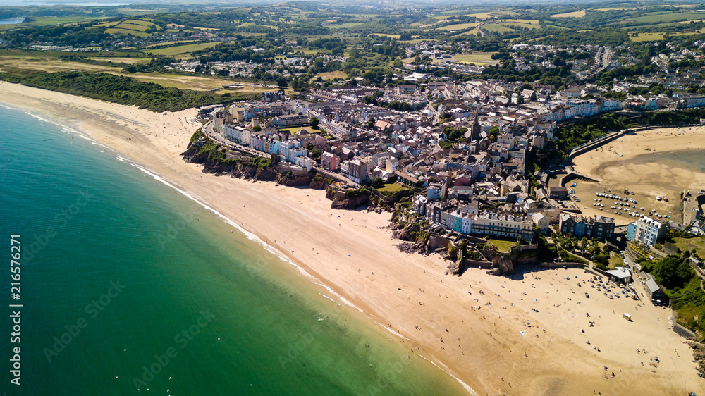 Aerial drone view of a picturesque and colorful coastal holiday town (Tenby, UK)