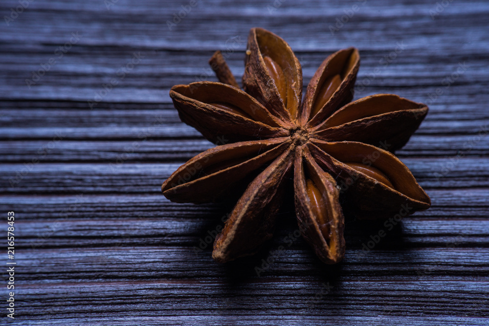 Star anise on blue rustic background