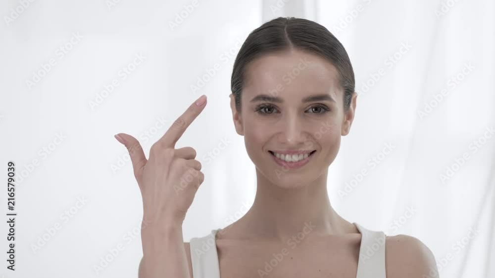 Attractive Woman Counting To Five On Fingers Attractive Woman Counting To Five On Fingers