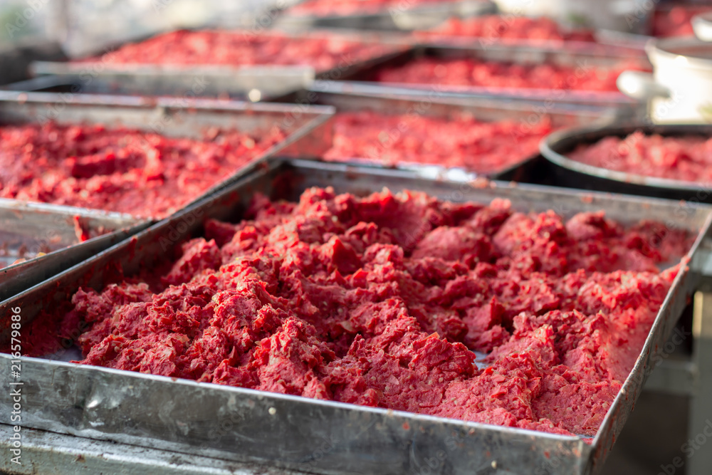 Close-up detail traditional handmade tomato paste making process shot under open air Close-up detail traditional handmade tomato paste making process shot under open air