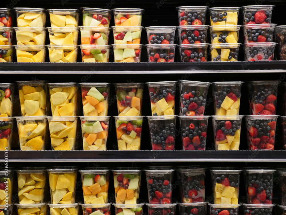 fruits in plastic containers in store