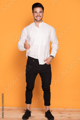 Handsome young man in elegant fashionable clothes photo