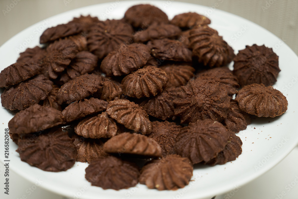 Cookies and sweet biscuits on white plate background, top view Cookies and sweet biscuits on white plate background, top view